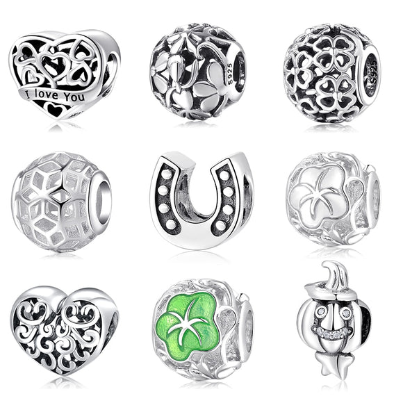 Charms, beads i forskjellige mønstre som hjerte, blomster, hestesko og mer